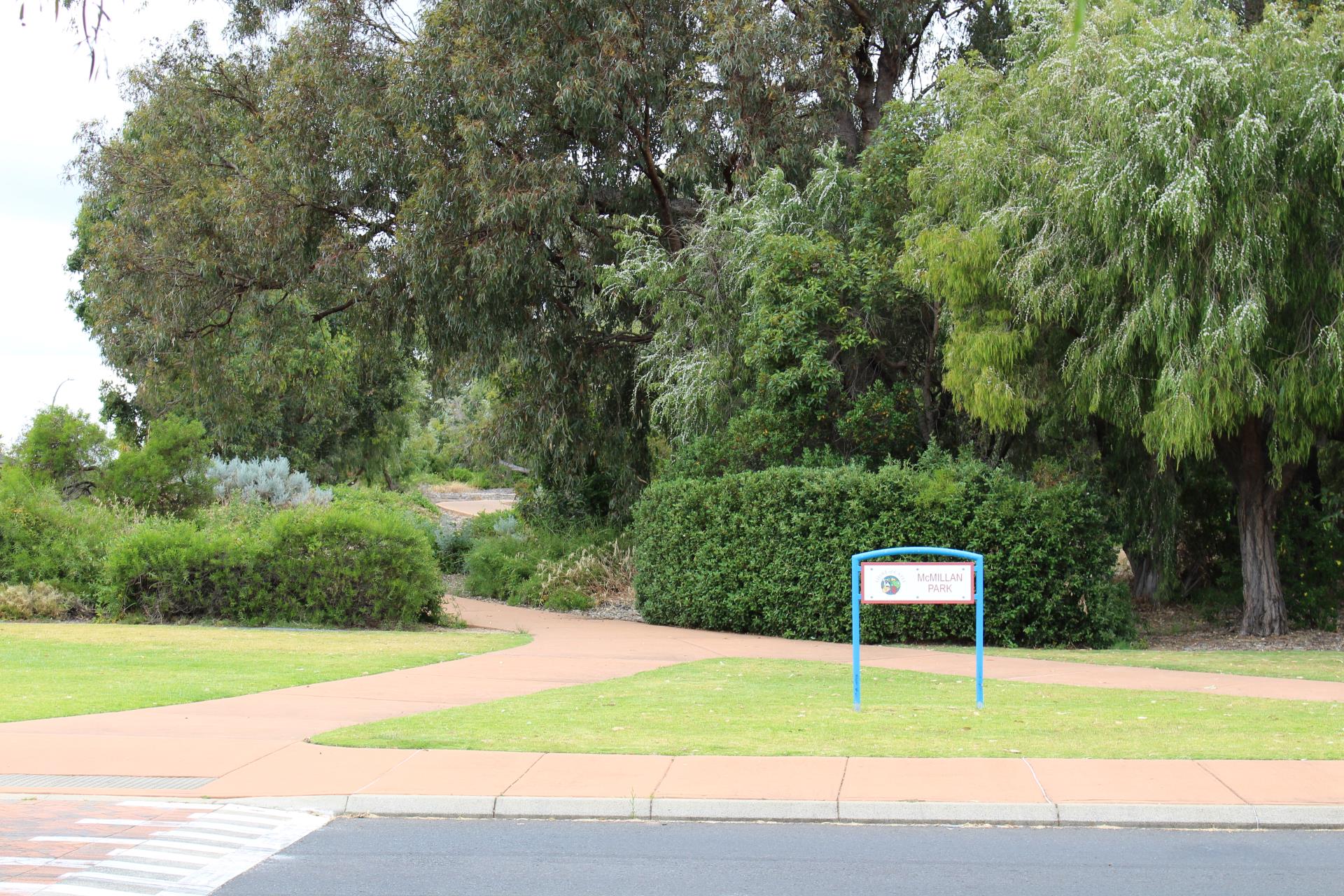 sign in park with trees