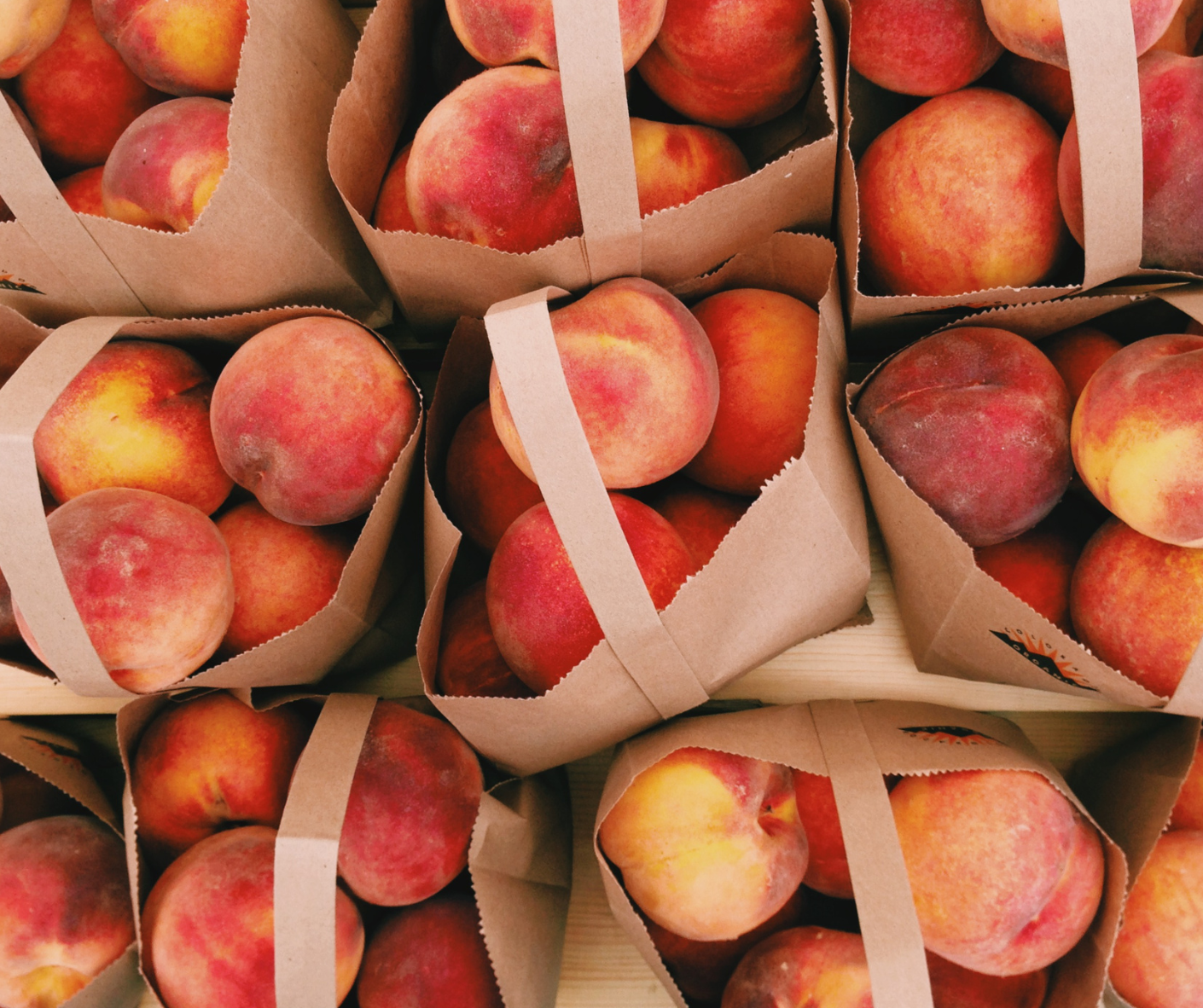 Red apples in paper bags